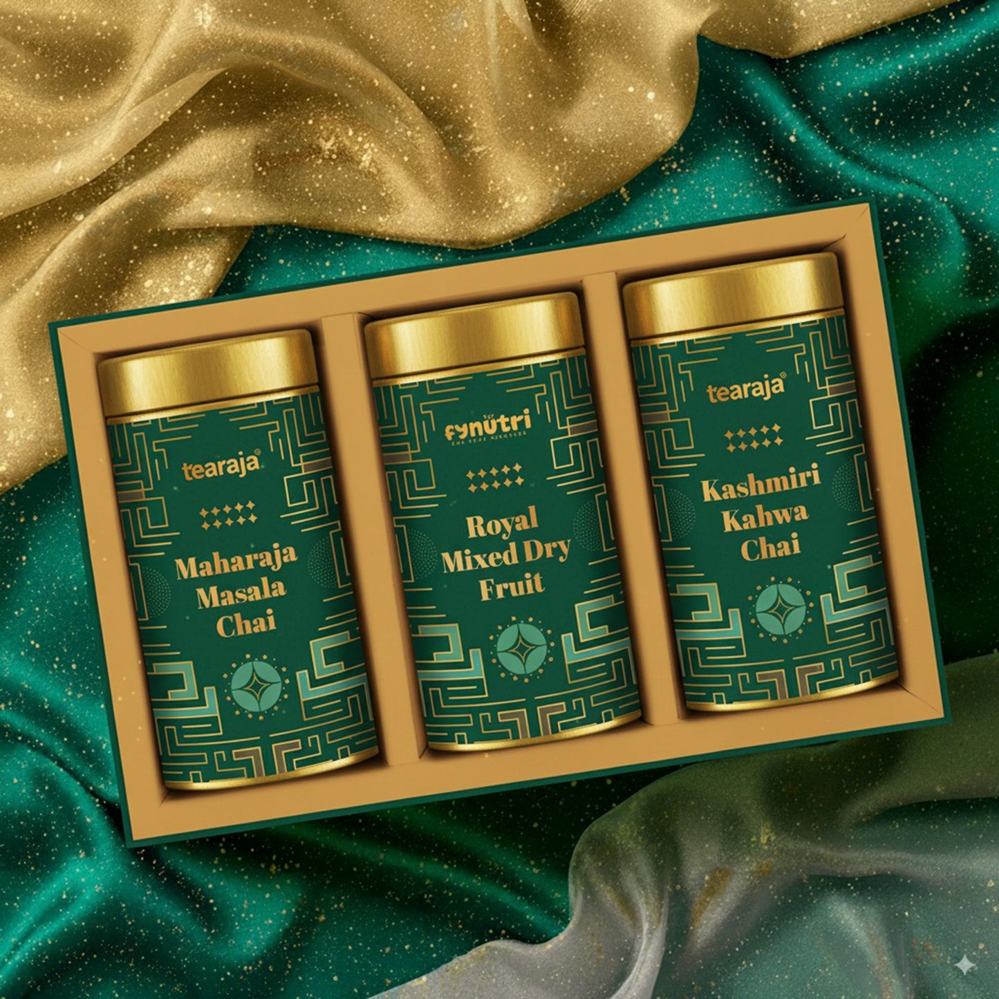 Celebrate Box premium gift hamper with three 100 g tins—Maharaja Masala Chai, Kashmiri Kahwa Chai, Royal Mixed Dry Fruit—arranged in a green kappa board box with gold foiling
