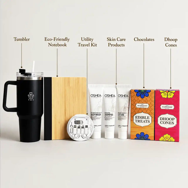 Labelled contents of the everyday gift hamper: tumbler, eco-friendly notebook, utility travel kit, travel toiletries, chocolates and dhoop cones
