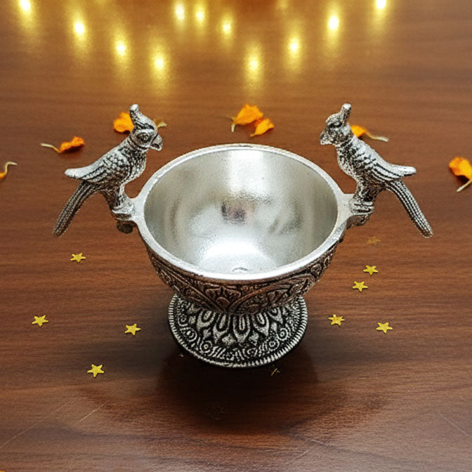 German Silver Parrot Bowl with intricate floral carvings and antique silver finish – side view