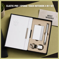 Elastic Pro employee welcome kit — white sponge-touch A5 notebook with elastic closure, metal card holder, pen and keychain in a black gift box
