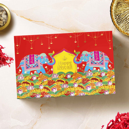 Close-up of brass candle stand and golden mesh cashew jar inside the “Celestia” Diwali curated hamper