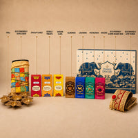 Labelled contents of the eco-friendly Diwali hamper: lotus urli, jute ludo board, dhoop cones, edible treats, havan cups, almonds, cashews, pistachios, raisins, kappa board gift box and jute toran
