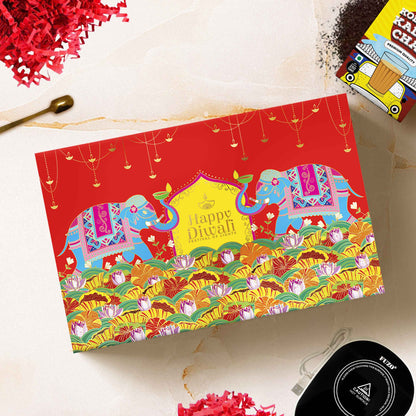 Close-up of artisan chai tins and festive treats in the Luxury Chai Lover Diwali gift box