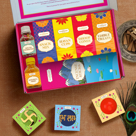 Open Lakshmi Ganesh Prosperity Box displaying pooja essentials and snacks