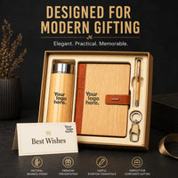 Premium bamboo corporate gift set styled for modern gifting — bamboo flask, bamboo-finish organiser with leather strap, bamboo pen and keychain