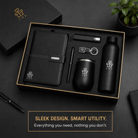 Matte Vault corporate gift set contents flat lay — A5 notebook, torch power bank, keychain, 500 ml insulated bottle, metal pen, insulated metal mug
