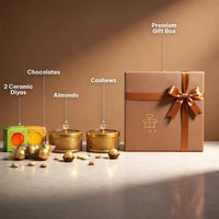 Labelled contents of the Diwali dry fruit hamper: two ceramic diyas, chocolates, almonds, cashews and the ribboned brown gift box