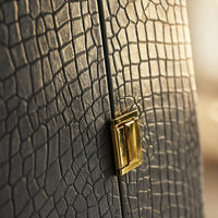 Close-up of the Royal Majesty trunk's silver-grey crocodile-textured finish