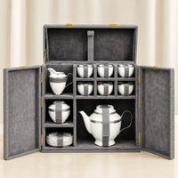 Royal Majesty 16-piece tea set arranged inside its velvet-lined keepsake trunk — 6 cups, 6 plates, kettle, milk pot and sugar pot
