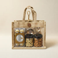 Compact eco-friendly jute gift hamper with premium dry fruits, chocolates, and urli diya.
