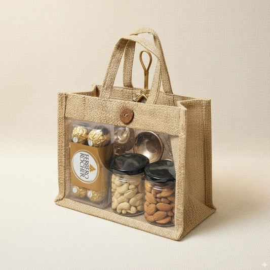 Eco Treasure Hamper with reusable jute bag containing Ferrero Rocher chocolates, cashews in jar, almonds in jar, and decorative golden urli diya.
