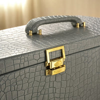 Detail of the gold-tone metal locks on the Royal Majesty tea set keepsake trunk