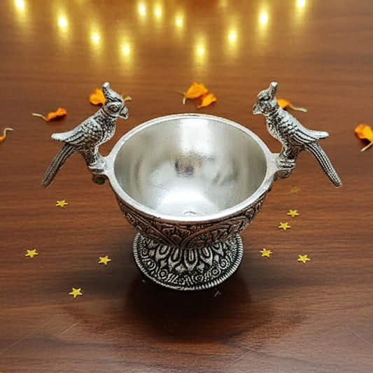 German Silver Parrot Bowl with intricate floral carvings and antique silver finish – side view