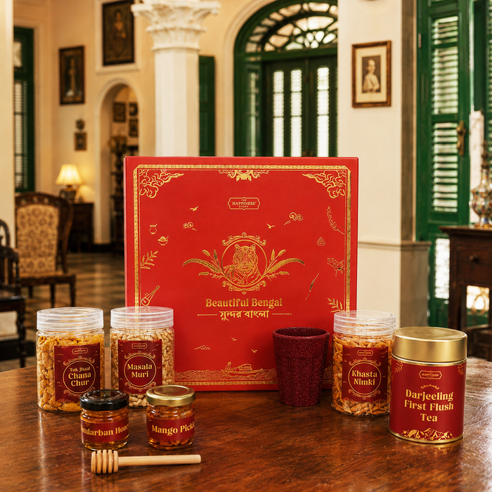 The Beautiful Bengal Box hamper — foil-stamped red gift box with nine Bengal-sourced items arranged beautifully