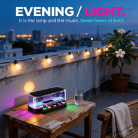 Transparent RGB Bluetooth speaker lit on a terrace table at dusk beside a glass of water, working as both a lamp and a speaker