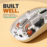 Close-up of the transparent wireless mouse shell showing the knurled metal scroll wheel and the orange silent switches underneath