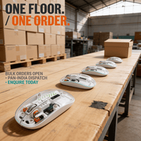 Five transparent wireless mice in a staggered row on a packing bench, ready for bulk corporate gifting orders dispatched across India
